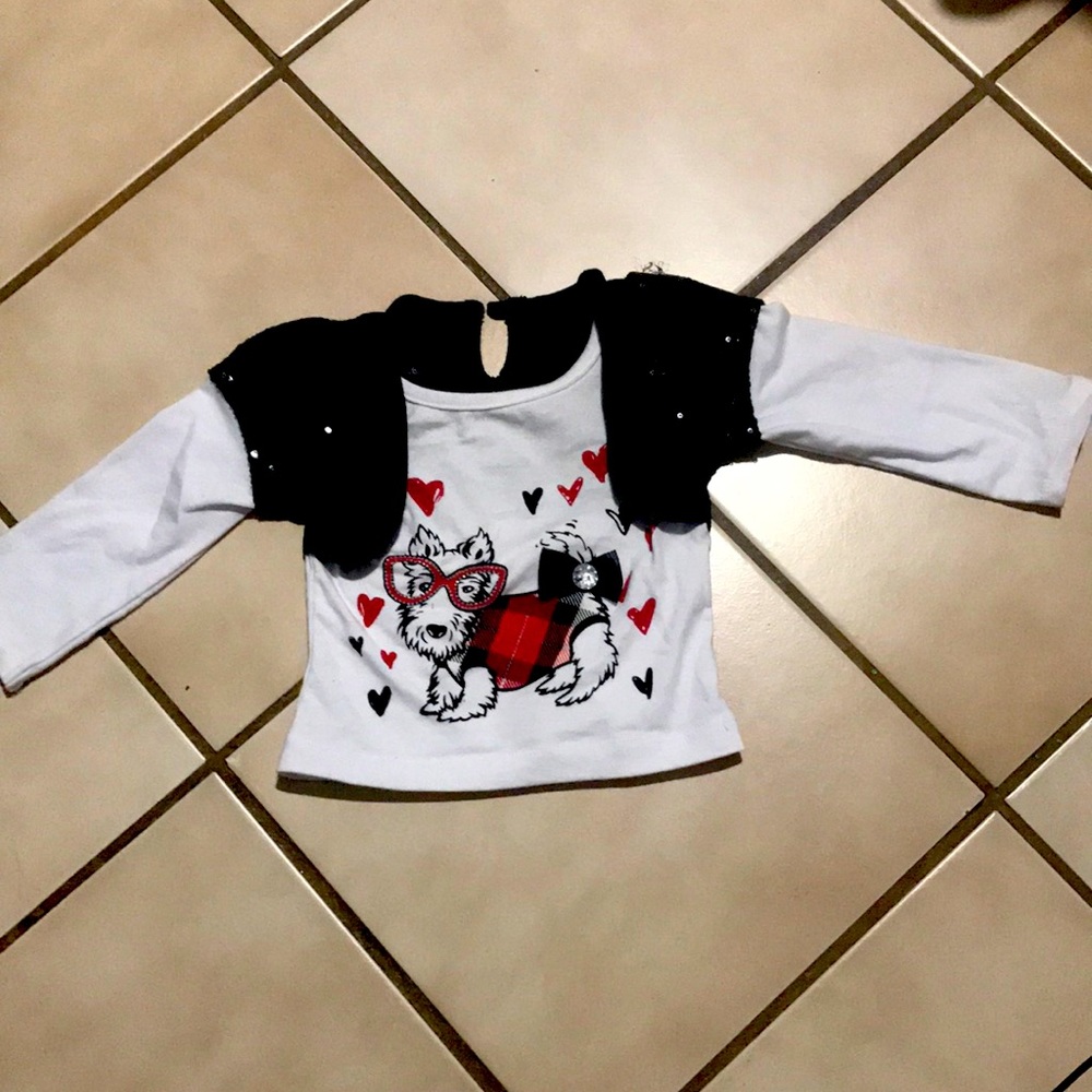A used Wonder Kids small tee-shirt, size 18m, colors black and white